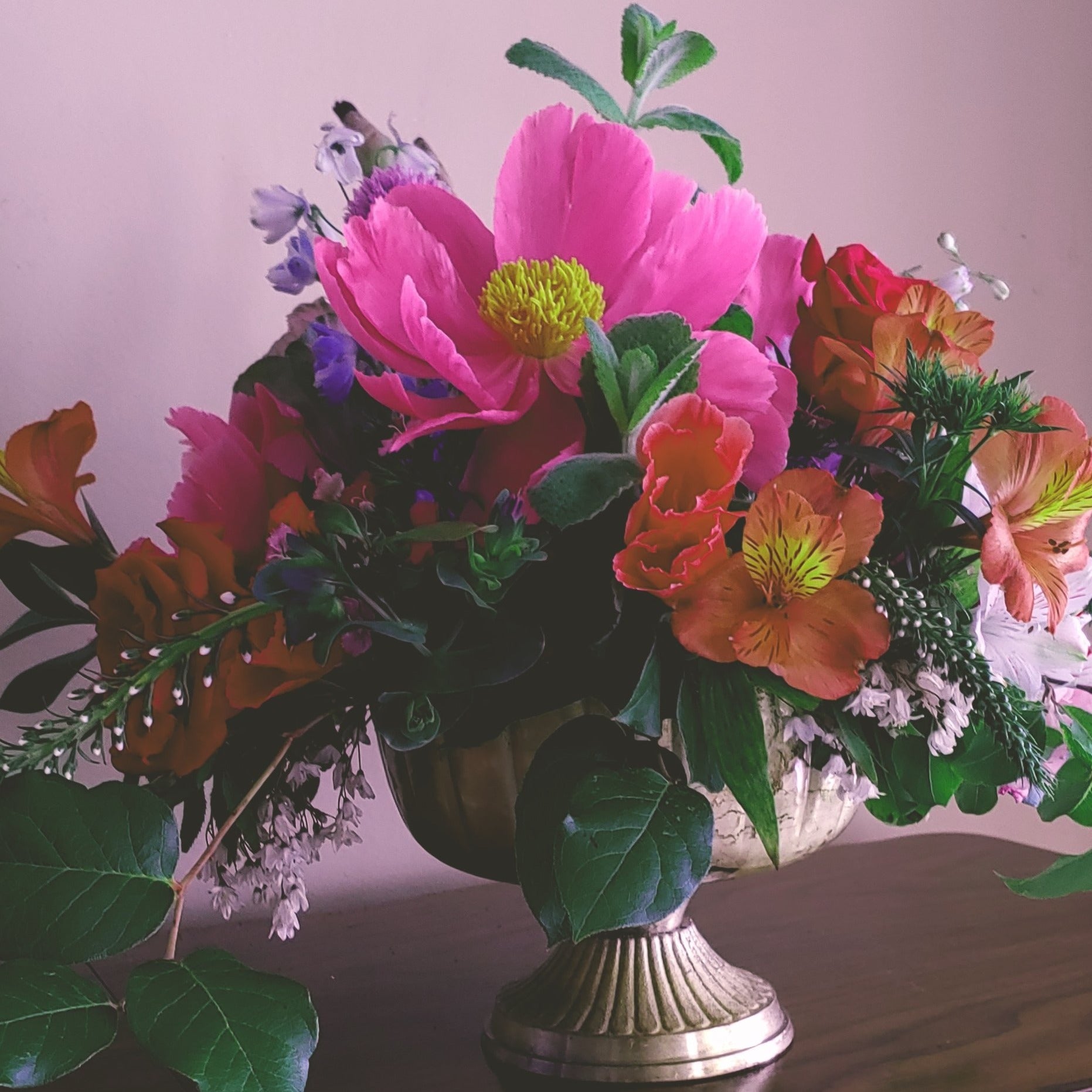 a vase of flowers sitting on a table 